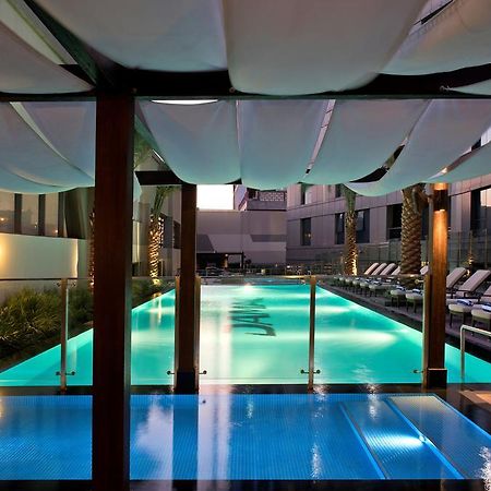 Damac Maison The Vogue Dubái Exterior foto The pool at the hotel